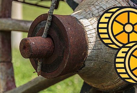 A wagon wheel in a field, and an illustration of some wagon wheel shaped pasta.