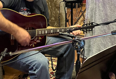 Steve playing guitar, cropped, in the studio