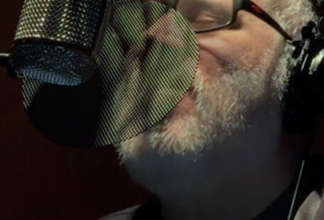 Close up of microphone and Steve laying down vocals.