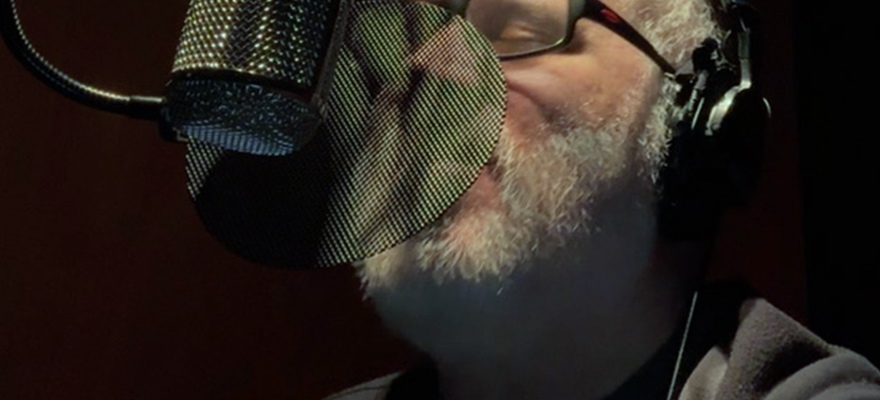 Close up of microphone and Steve laying down vocals.